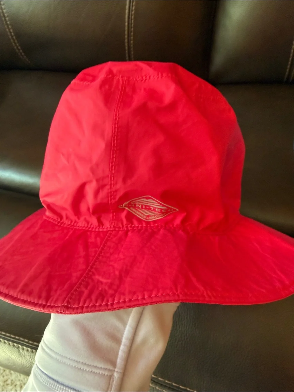 2 Columbia Kids Bucket Hats in Red and Light Blue.